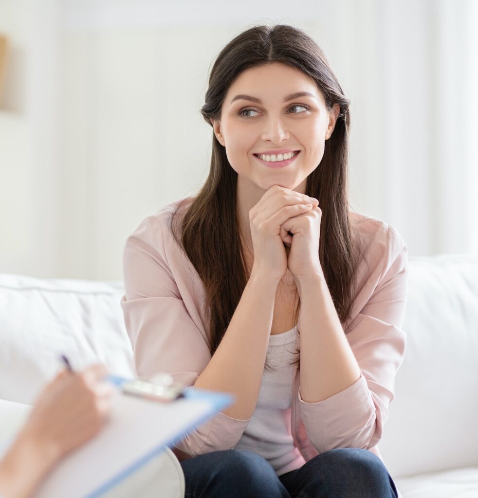 Smiling woman talking to wellness coach about motivation